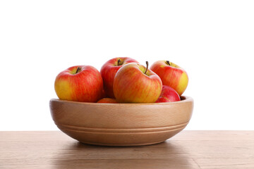 Ripe red apples in bowl on wooden table against white background, closeup