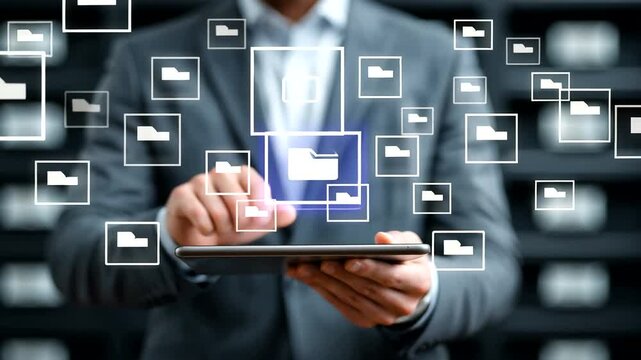 Businessman Managing Digital Files with Virtual Folder Icons in Modern Office Environment