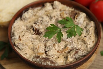 Tasty beef Stroganoff with parsley served on table, closeup