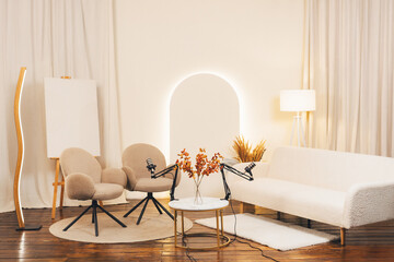 Cozy podcast studio setup with microphones and stylish furniture for engaging conversations
