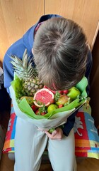 young boy with a basket of fruits
