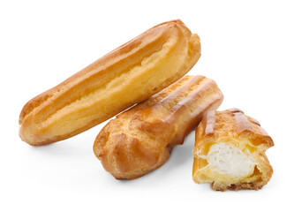 Tasty eclairs with whipped cream isolated on white