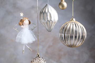 Fototapeta premium Beautiful Christmas decor hanging near light grey wall, closeup