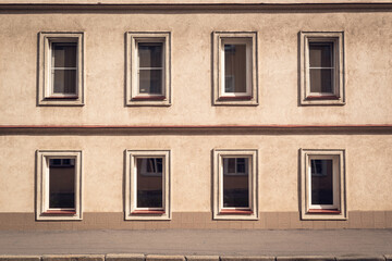 Building facade with aligned rows of minimalist windows