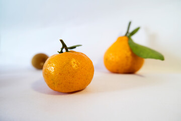 Fresh Oranges and Tropical Fruits on White Background