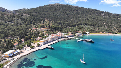 Obraz premium Aerial drone photo of iconic bay and holy Monastery of Archangel Michael Panormitis, Symi island, Dodecanese, Greece