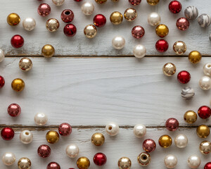 Assorted Beads Scattered on White Wooden Surface Keywords: beads, crafting, jewelry making