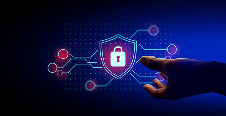 hand of businessman interactive touching a holographic anti-virus security shield system network and technology, success of innovation