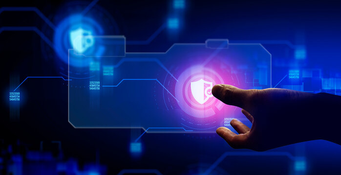 hand of businessman interactive touching a holographic anti-virus security shield system network and technology, success of innovation
