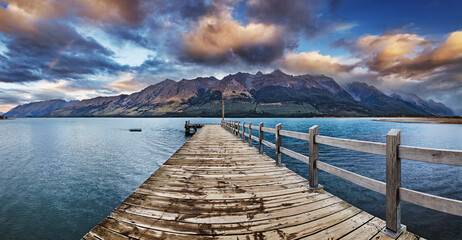 Panoramic view of Wakatipu Lake from Glenorchy pier at sunrise in New Zealand