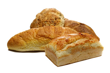 Fresh baked, pile of loaves of bread isolated on white background, side view