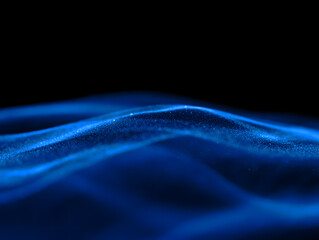 Abstract flowing blue light waves against a dark black background