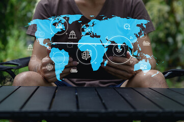 Young Person Using Tablet with Digital World Map Overlay Visual