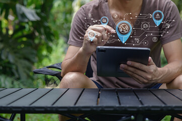 User Engaging with Technology in Nature with Digital Interface Overlay