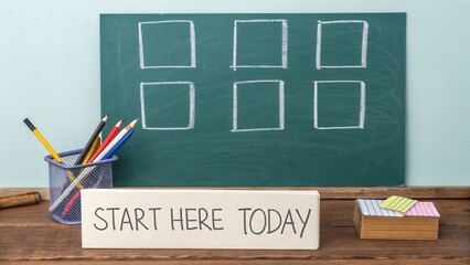 Overhead view of a chalk drawn weekly chart with squares