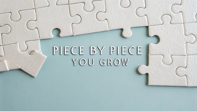 Puzzle pieces partially joined with positive motivational message