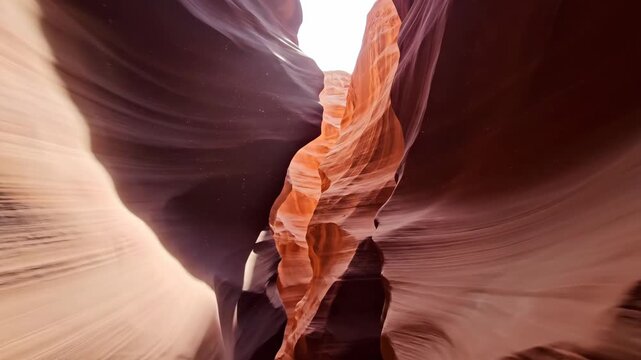 Antelope Canyon Sandstone Formation - This video captures the reddish-brown sandstone walls of Antelope Canyon, showcasing the natural light filtering through the geological formation.