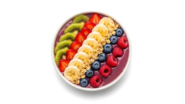 Healthy breakfast acai bowl topped with colorful fresh fruit and crunchy granola, top view.