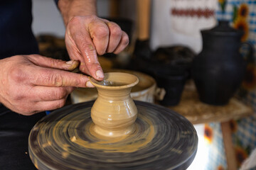 Skilled Potter Shaping Clay on a Wheel