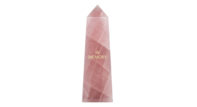 Isolated Rose Quartz Crystal Point displaying the phrase "In Memory" to serve as a reminder