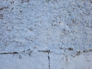 Texture of old rustic wall covered with gray stucco plaster