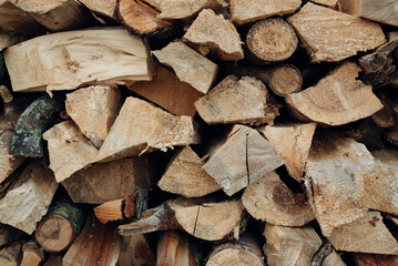 Close-up of a neatly stacked pile of firewood ready for winter