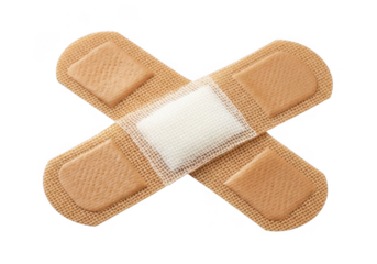 Two adhesive bandages crossed forming an x shape isolated on transparent background