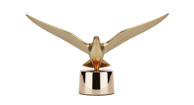 Isolated golden bird sculpture, flying with wide spread wings, awards trophy on base, gold toned