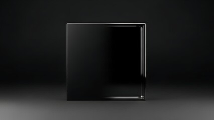 Black rectangular block on a dark background with subtle lighting.