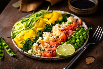 Healthy bowl with salmon and vegetables