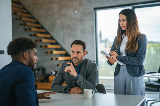 Business professionals conducting job interview with male candidate - Powered by Adobe