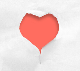 Heart shaped hole in torn paper on red background.
