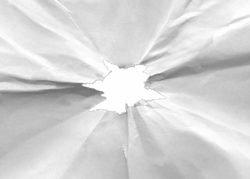 Hole in crumpled paper with torn edges isolated on transparent background.