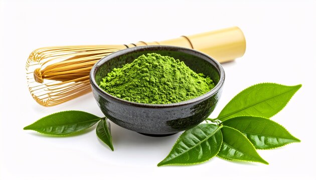 A bowl of matcha powder and green tea leaves with a traditional matcha whisk on a white background