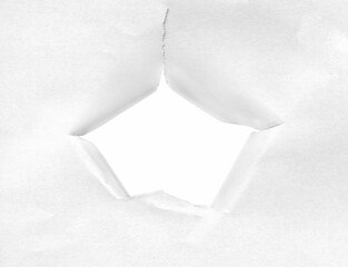 Ragged hole in paper with torn edges facing inwards on  transparent background.
