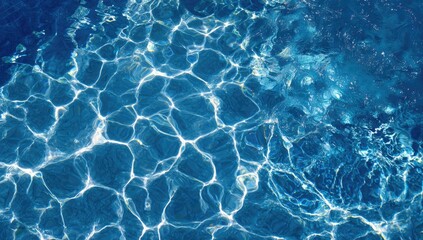 Close-up of water surface with sunlight refracting and creating patterned effects
