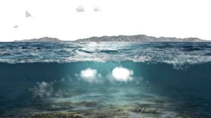 Waves of blue ocean water splash on the summer beach coast under a vast blue sky