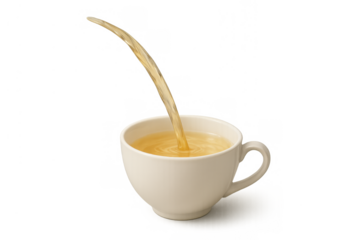 Warm tea pouring into a white porcelain cup, creating ripples on the surface, a comforting hot beverage being served