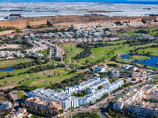 Naklejka premium Aerial View of the Golf Course and New Condo Construction Site in Almerimar, on the Mediterranean Coast of Andalusia