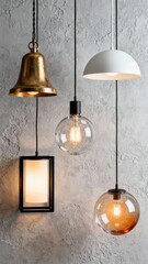 Various pendant lights with different designs hanging against a textured gray wall