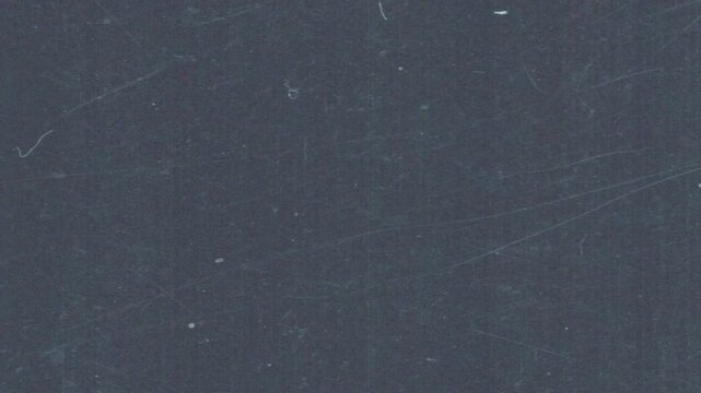 Cinematic analog film grain loop with subtle grind texture and dust artifacts. Ideal as an overlay or background for editors seeking authentic retro aesthetics in horizontal format.