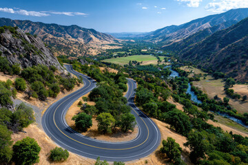 Fototapeta premium Winding Mountain Road Through Scenic Valley
