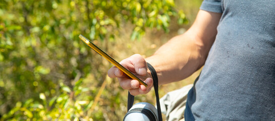 Man using smartphone in outdoors.