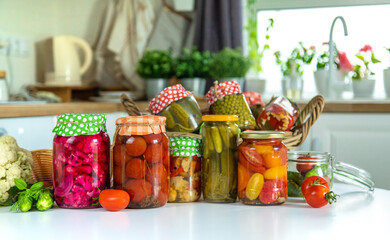 Jars with preserved vegetables for the winter. Selective focus.