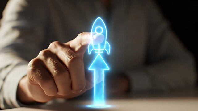 Hand Interacting with Holographic Rocket Ship and Upward Arrow Launching into Space on White Table with Dark Background Light Blue and White Shirt