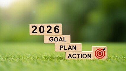 3d illustration of wooden blocks illustrating a 2026 goal plan with action steps, set against a blurred green backdrop, symbolizing strategic planning and future objectives
