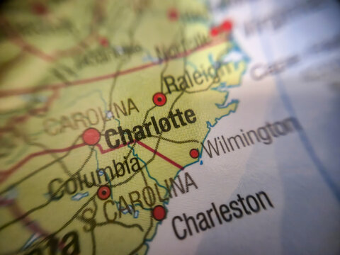 Warsaw, Poland - November 28, 2025: Close-up view of a map highlighting Charlotte, North Carolina, with visible roads and neighboring cities, illustrating geographic connectivity.