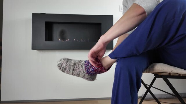 Chilly evening spent wrapped in cozy pajamas by glowing fire