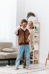 Authentic scene of children at play at home, capturing joyful mischief and friendship as they...