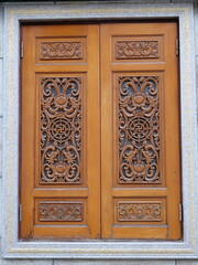 Ornate Wooden Door with Intricate Carvings and Detailed Patterns